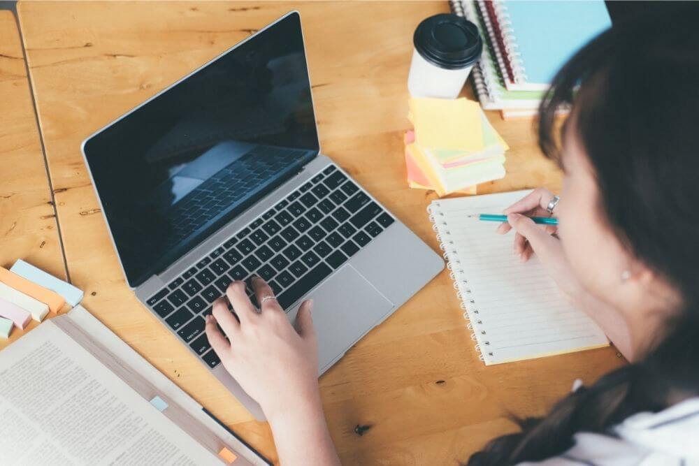 Girl using laptop to research