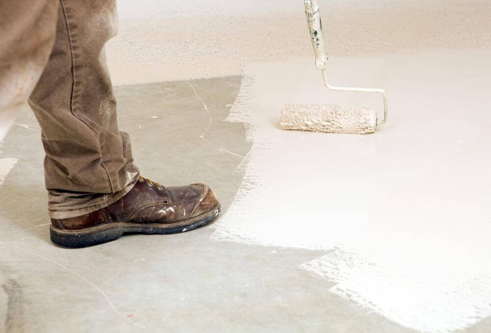 Person painting garage floor