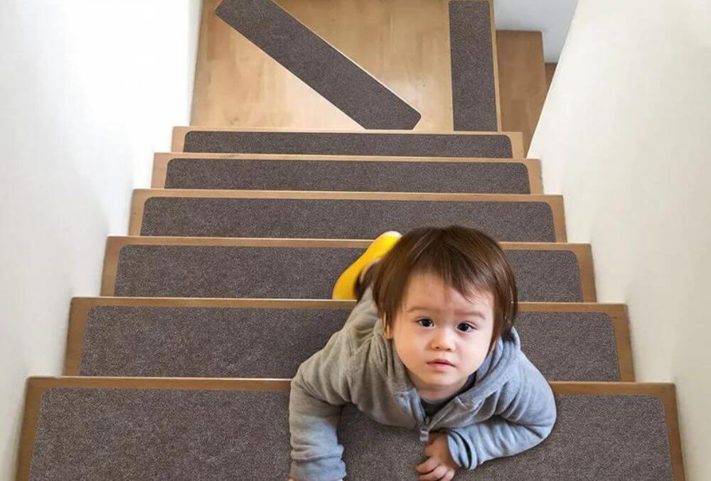 baby boy climbing up the stairs