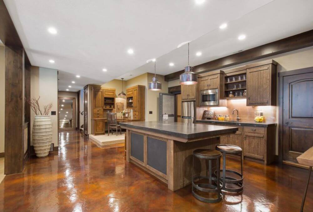 erracotta-themed kitchen with a stylish countertop table and wooden cabinets