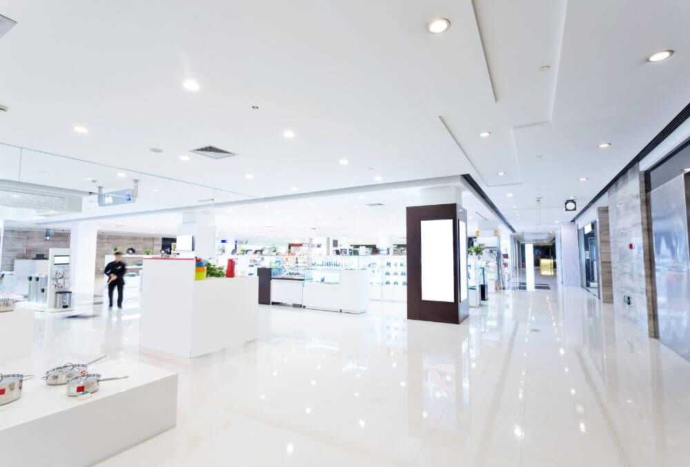 interior view of a spacious mall with well-lit storefronts