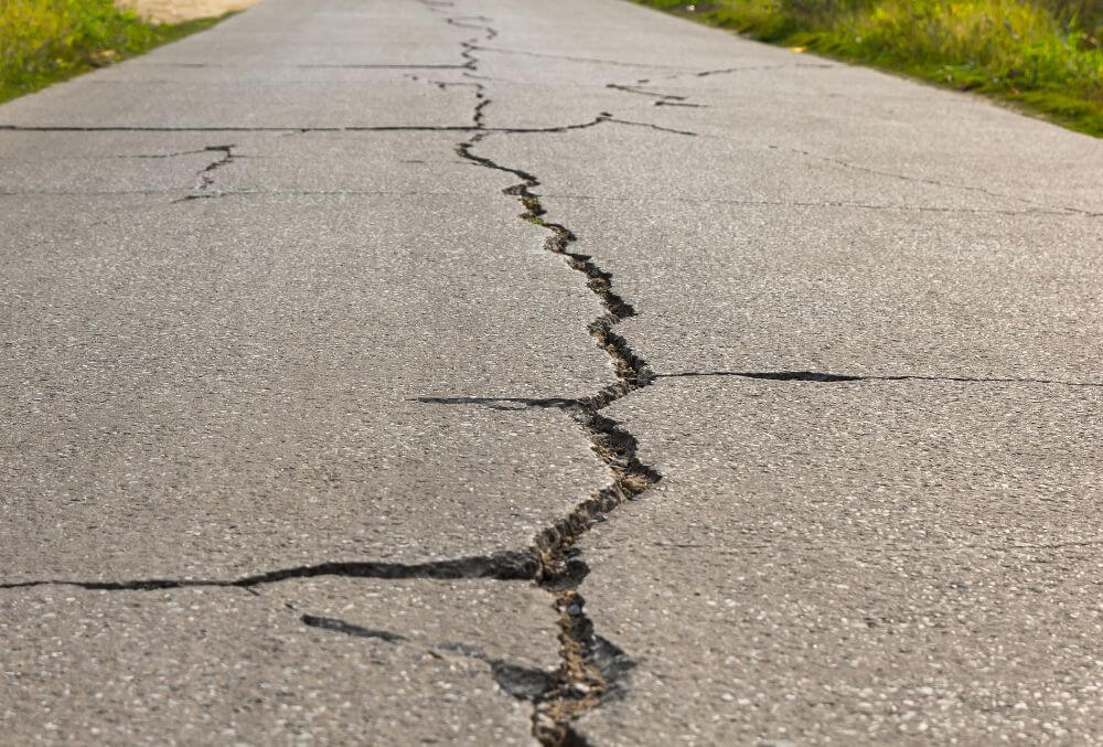 Surface of concrete driveway with crack