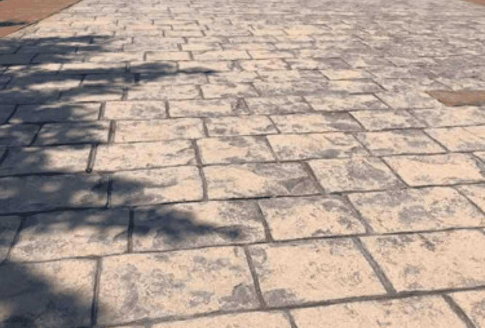fading stamped concrete overlay