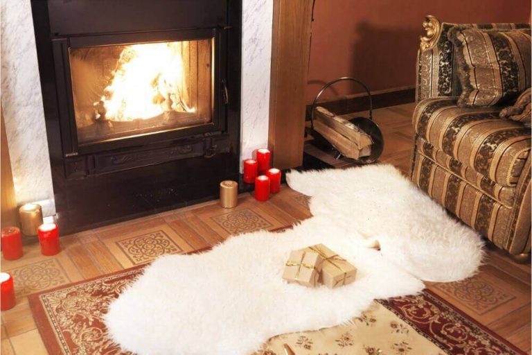 White carpet in front of fireplace
