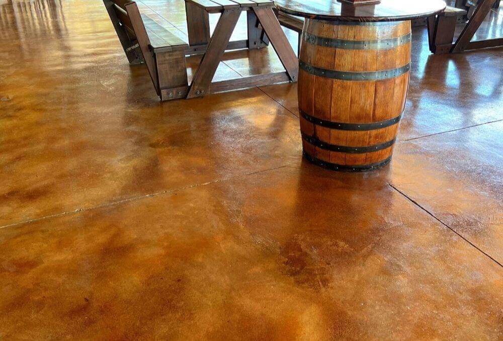 tangerine-colored floor with a rustic barrel accent
