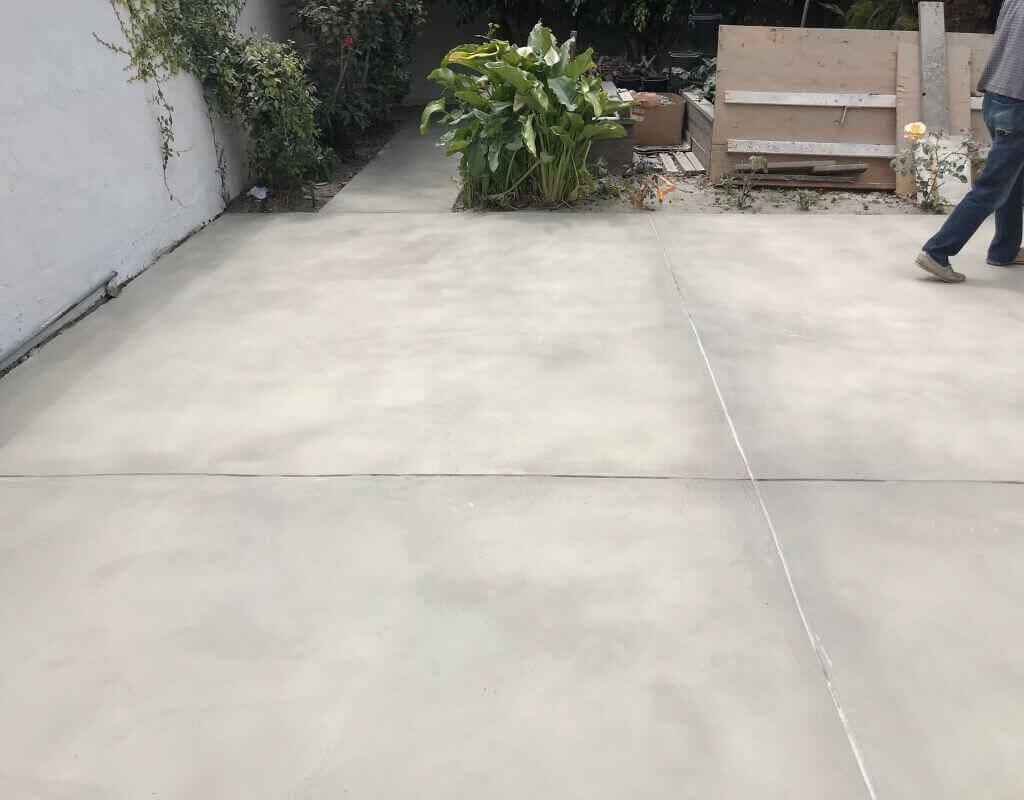Plain concrete overlay in a residential patio