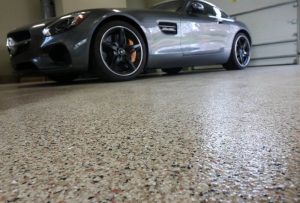 car parked on the garage floor coatings