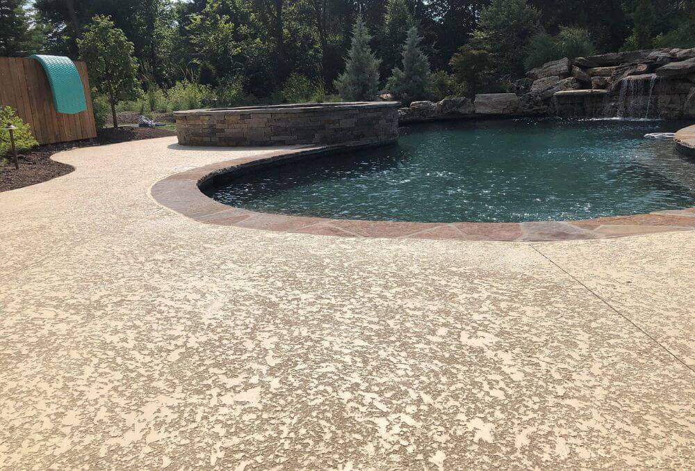 Spray texture flooring in a concrete pool deck