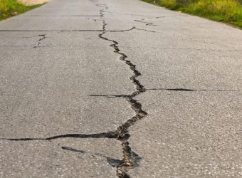 Surface of concrete driveway with crack