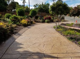 Stamped concrete driveway with brown stain