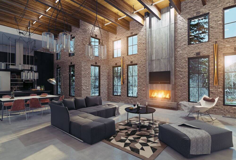 wide living room area with couch and lit fireplace