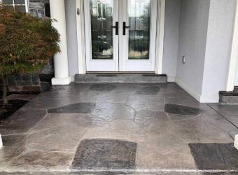 Two-toned stamped concrete overlay with acrylic coating entryway