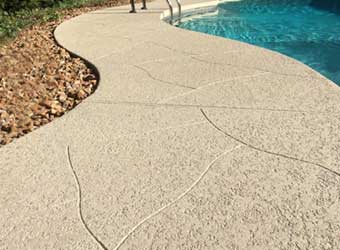 decorative concrete pool deck with textured slip-resistant surface