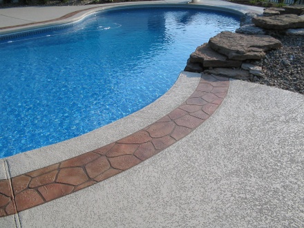 stamped concrete pool deck with decorative border design