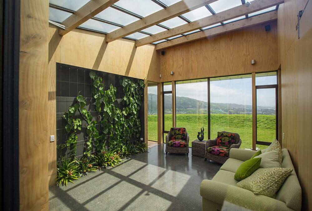 wide open area living room space with cozy chairs and plants