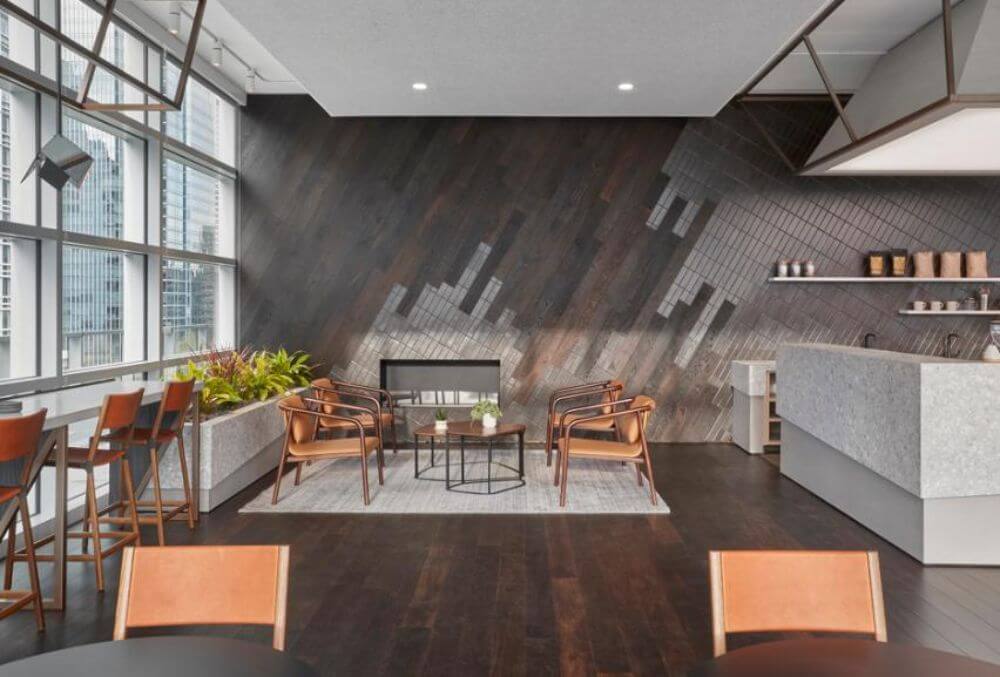 wood style themed business space with chairs and flowers in a pot