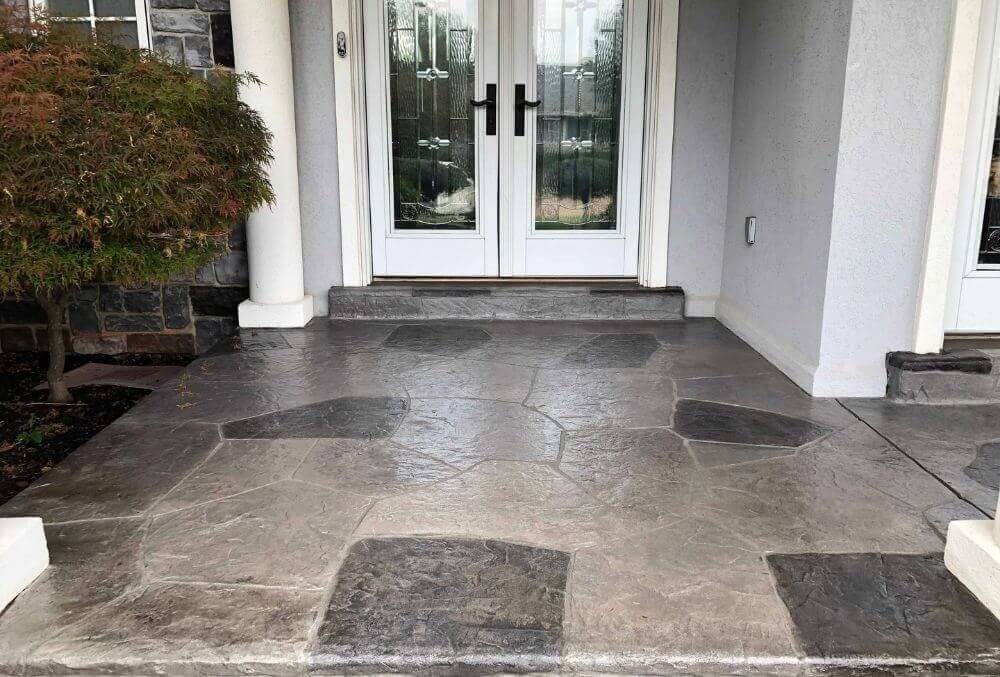 stamped concrete porch with white glass door