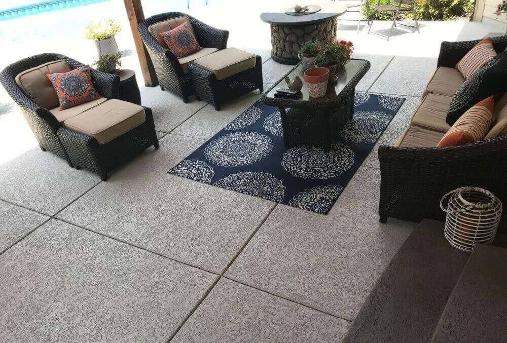 patio with set cozy of chairs and bohemian throw pillow