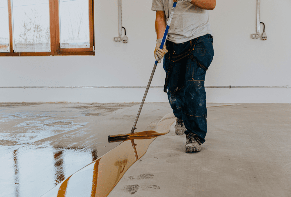 man applying epoxy coating