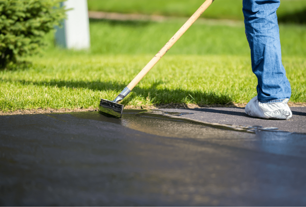 contractor applying concrete driveway