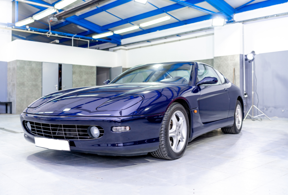 blue car parked inside a garage