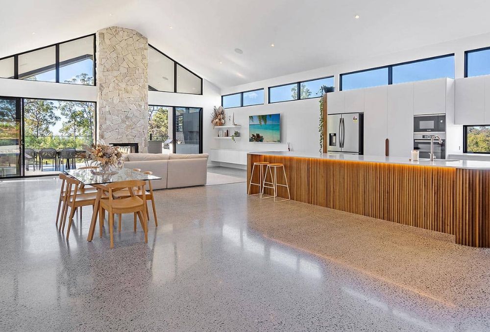 Polished concrete flooring in a residential living area, showcasing a smooth, seamless surface that adds durability, low maintenance, and a modern, elegant look to the home.